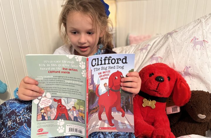 girl reads clifford graphic novel for kids